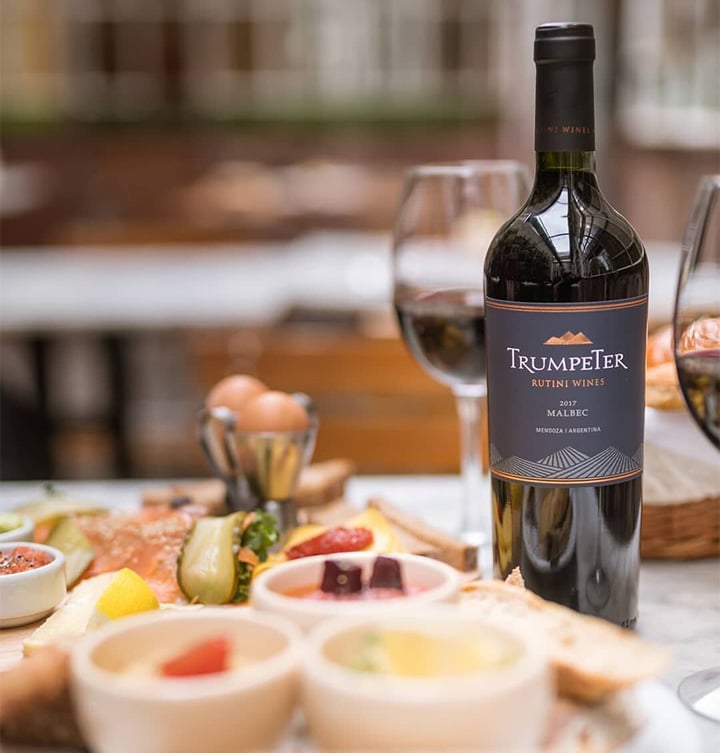 Trumpeter, a popular Malbec wine from Mendoza in Argentina, alongside an antipasti platter