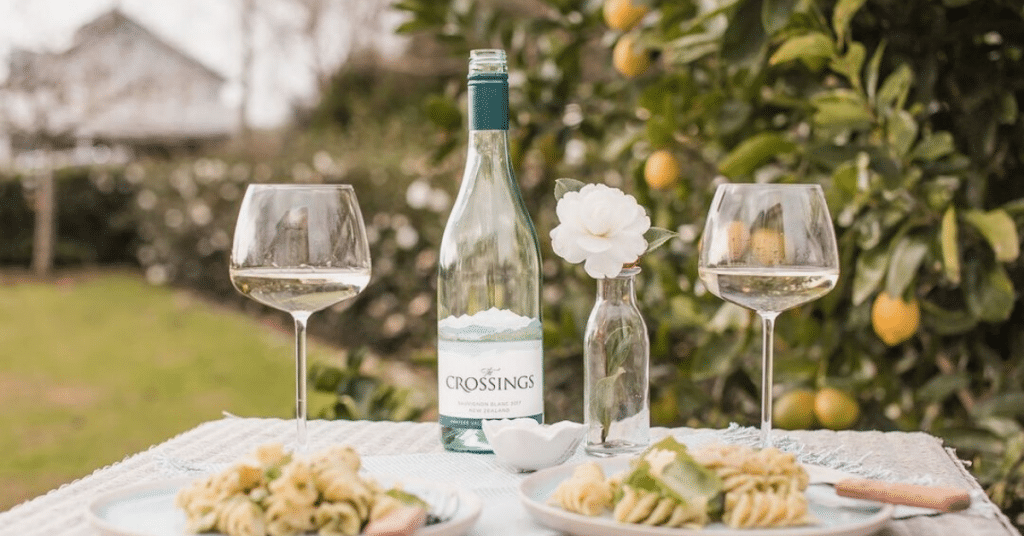 The Crossings Sauvignon Blanc on a table paired with a light dish