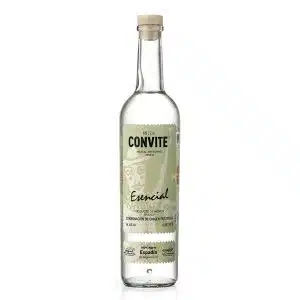 Bottle of Convite Esencial Espadín Mezcal displayed on a rustic wooden surface, reflecting its artisanal origin and clean, smoky character.