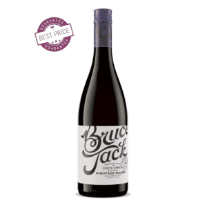 A bold bottle of Bruce Jack Pinotage Malbec set against a rustic wooden table, with rich garnet tones in a wine glass—capturing the essence of South African craftsmanship.