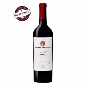A bottle of Heritage Cahors Malbec 2021 with an elegant label, showcasing French craftsmanship against a rustic background.